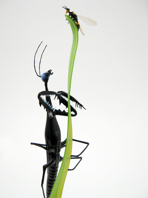 Mantis Stalking a Wasp, glass preying mantis by Wesley Fleming